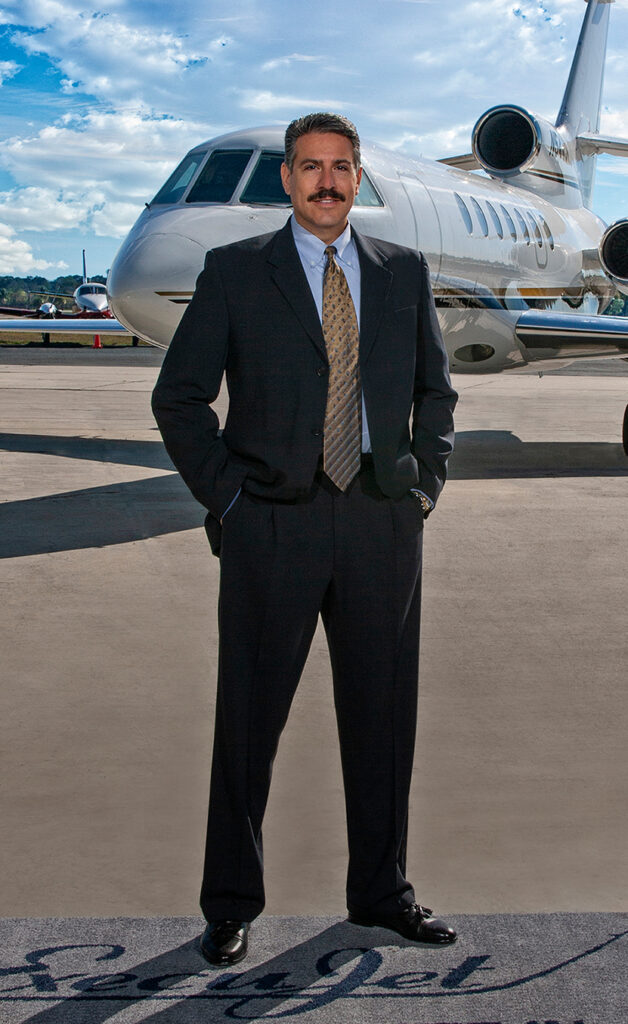 ExecuJet Owner with jet in background